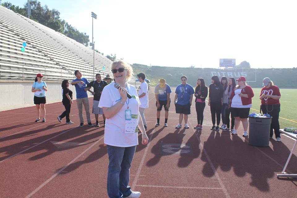 Kendall Gagliano hosting the “Denim Dash,” in Spring 2015 at the Citrus College Stadium. The event raises awareness of rare diseases. 