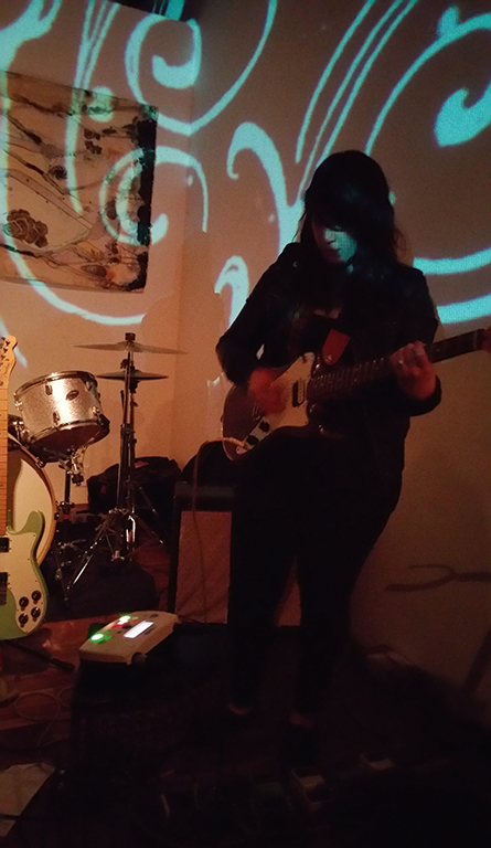 Iris guitarist Alex Moreno performing at DBA256 in downtown Pomona. (photo by: Evan Solano/Logos)