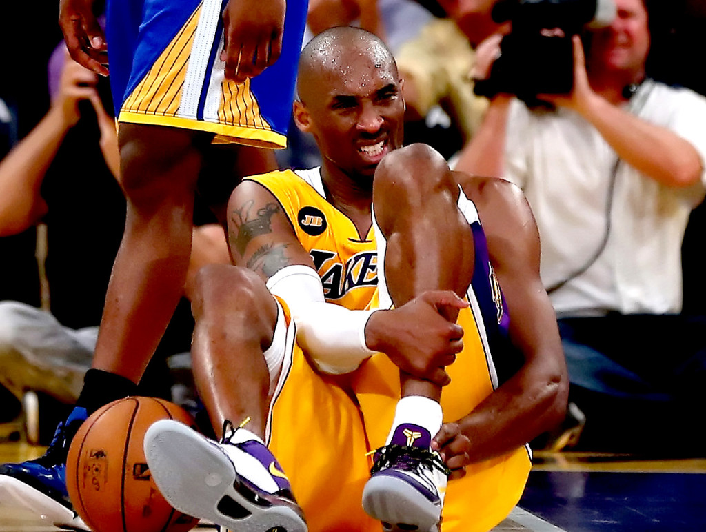 LOS ANGELES, CA - APRIL 12: Kobe Bryant #24 of the Los Angeles Lakers injur...