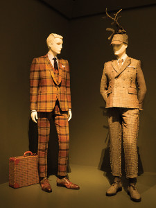 Photo by: Vidal Espina Figure on Left: Ensemble, Ken Etro for Etro Fall/Winter 2014-15 Figure on right: Ensemble, Thom Browne Fall/Winter 2014-15 Hat, Stephen Jones for Thom Browne